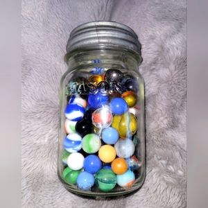 Vintage marbles and Mason jar
